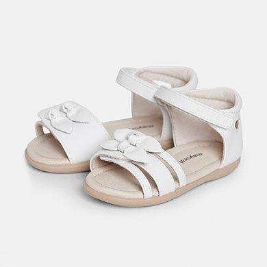 white velcro strap sandals